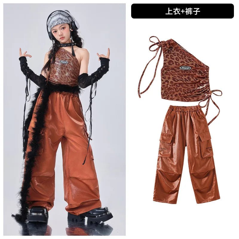 Brown outfit with leopard print top and wide-leg pants, worn by a model on a gray background.