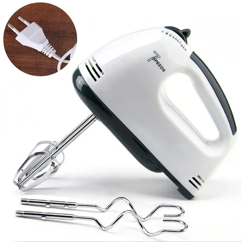 Hand mixer with attachments on a white background