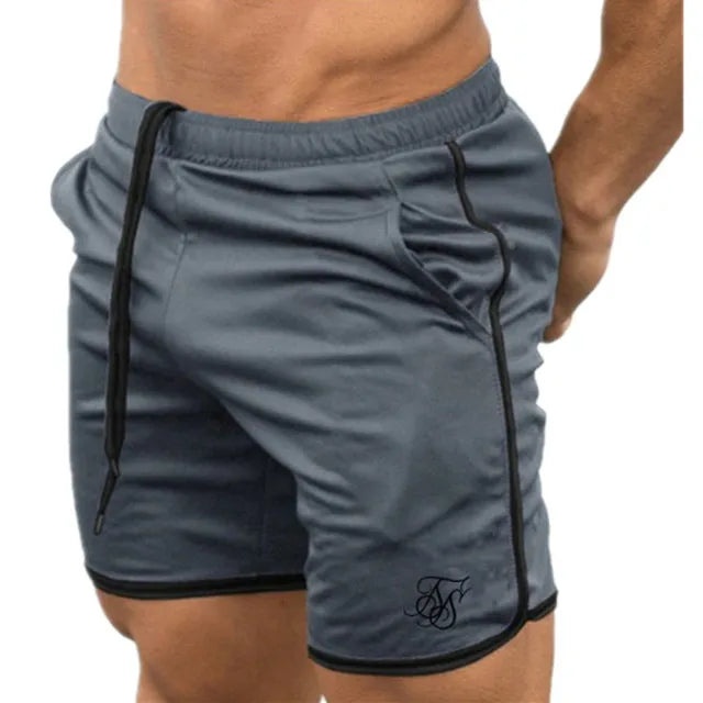 Gray athletic shorts with black trim on a white background
