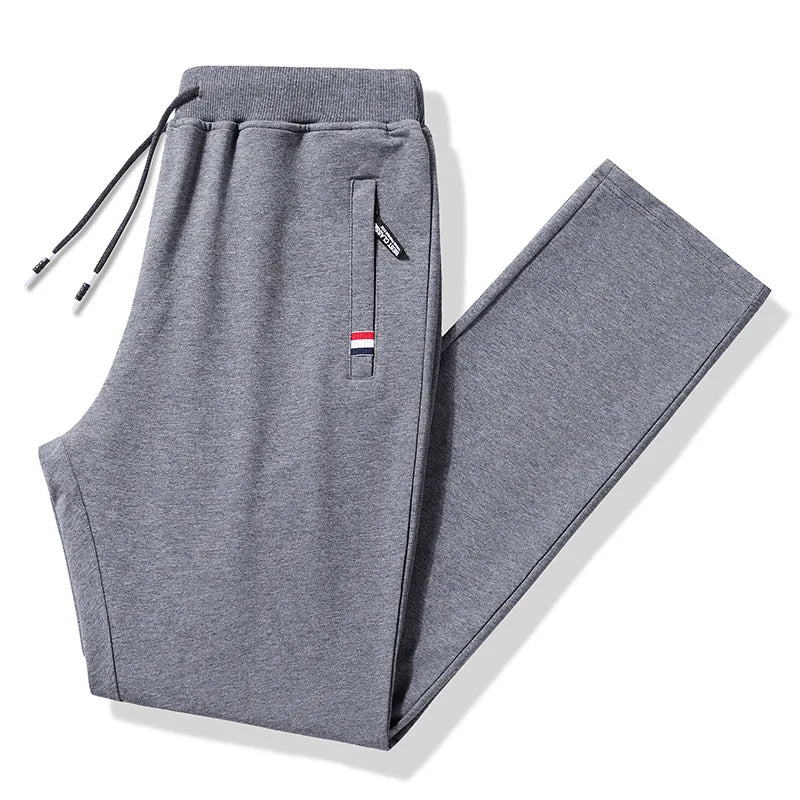 Gray sweatpants with a brand logo on a white background