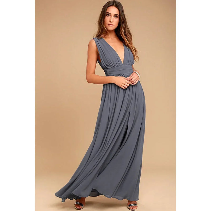 Woman wearing a long blue dress against a beige background
