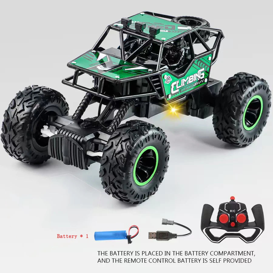 Toy monster truck with large wheels and remote control on a gray background