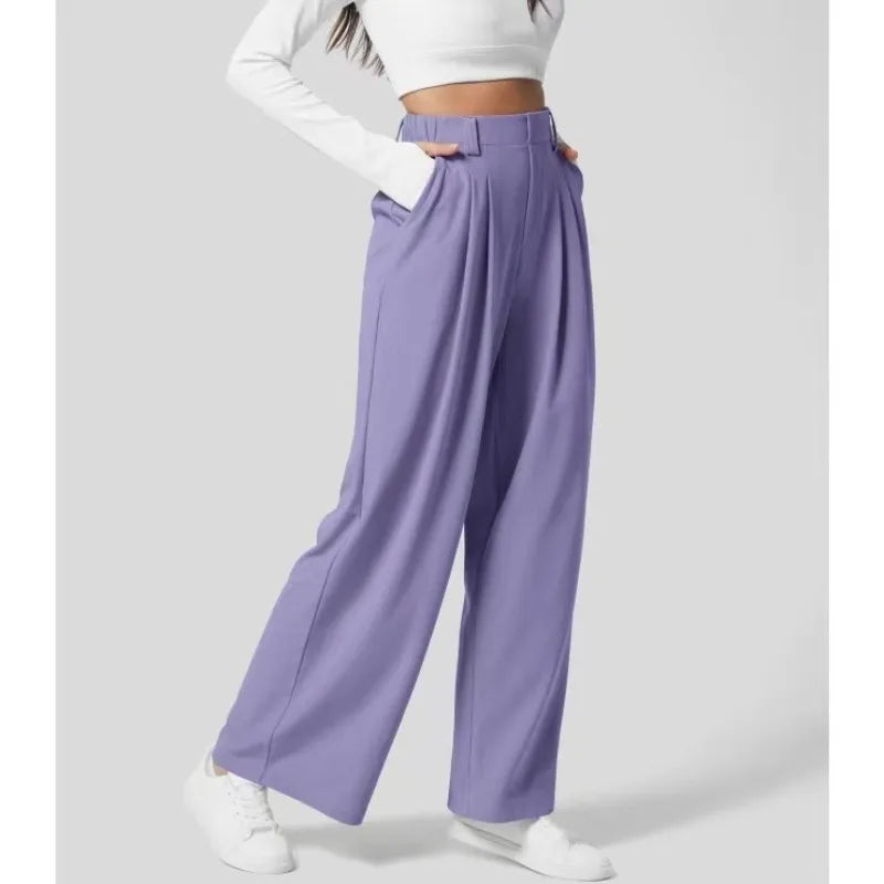 Purple wide-leg pants worn by a person on a white background