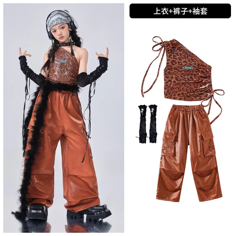 Brown leather outfit with matching bag and boots on a white background