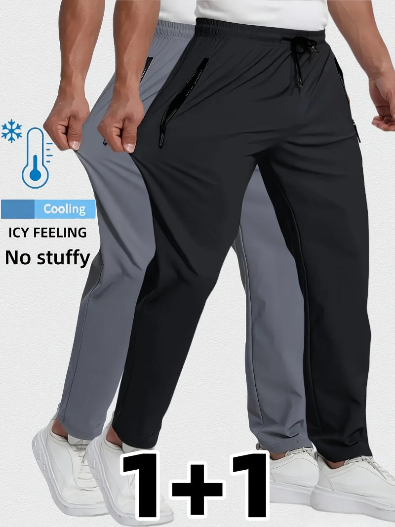 Two pairs of pants, one black and one gray, worn by a person on a white background.