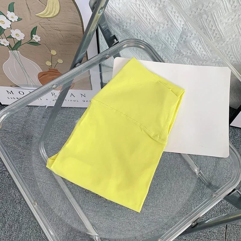Yellow fabric on a clear plastic chair with a blurred background
