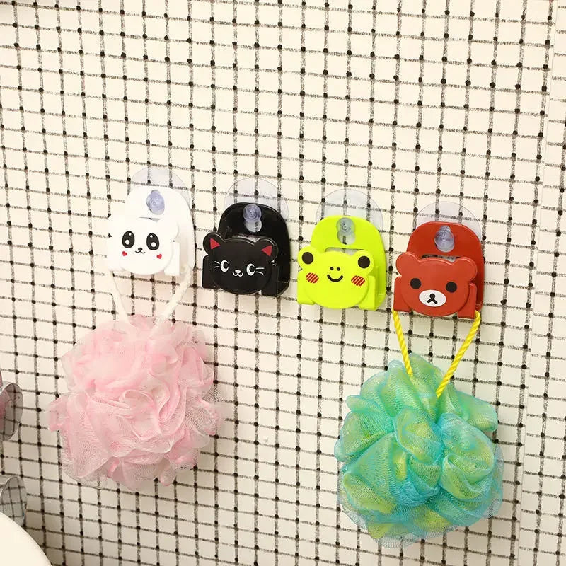 Four colorful cartoon-style hooks with bath products on a grid background
