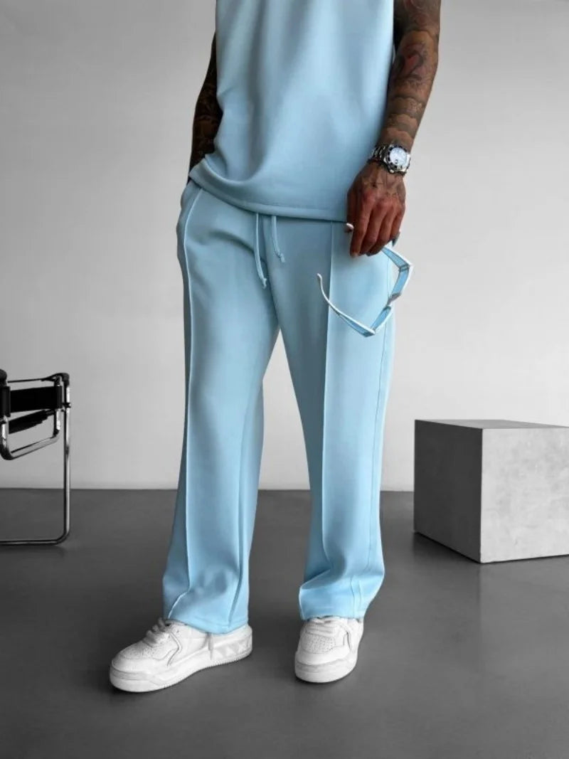 Men’s casual solid-color pants with elastic waist, drawstring closure, and side pockets L blue