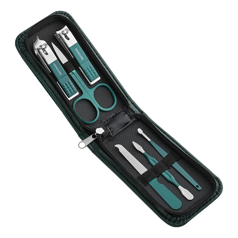 Manicure set with scissors, clippers, and other tools in a black case on a white background