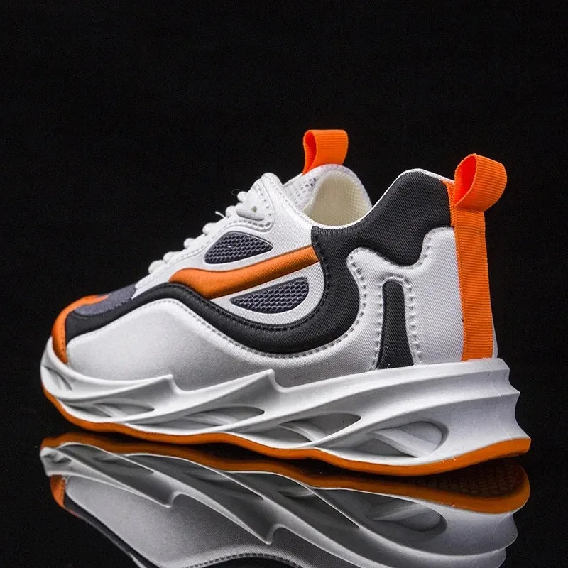 White, black, and orange sneaker on a reflective black surface with a black background