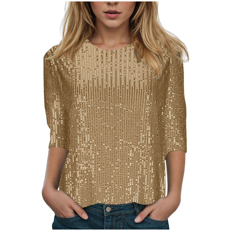 Gold sequin top worn by a person on a white background