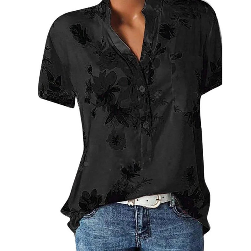 Black floral embroidered shirt worn by a model on a white background