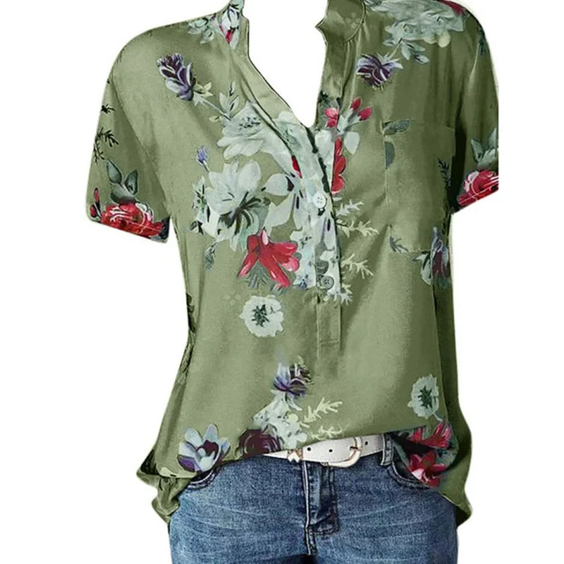 Green floral blouse with a white belt on a white background