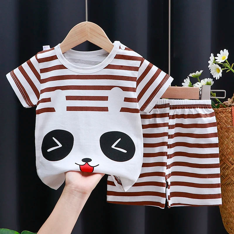 Children's panda-themed outfit with striped shirt and shorts on a hanger against a dark background.