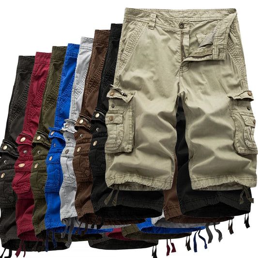 Stack of various colored cargo shorts on a white background