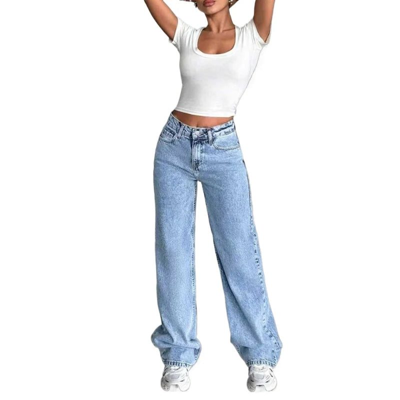 Person wearing a white crop top and light blue jeans on a white background
