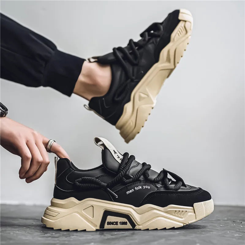 Black and beige sneakers with text on a gray background