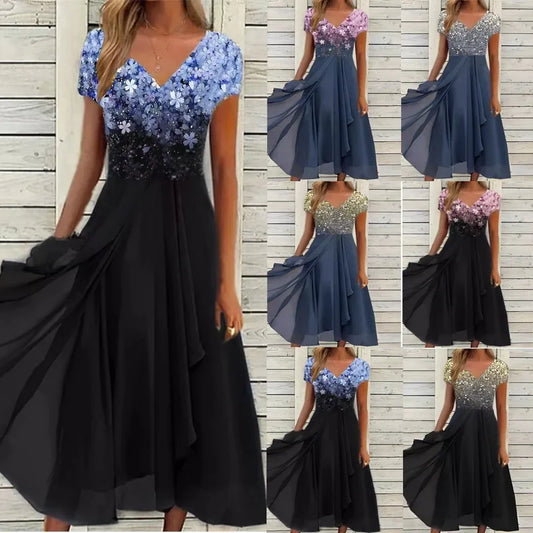 Black and blue dress with floral top on a wooden background