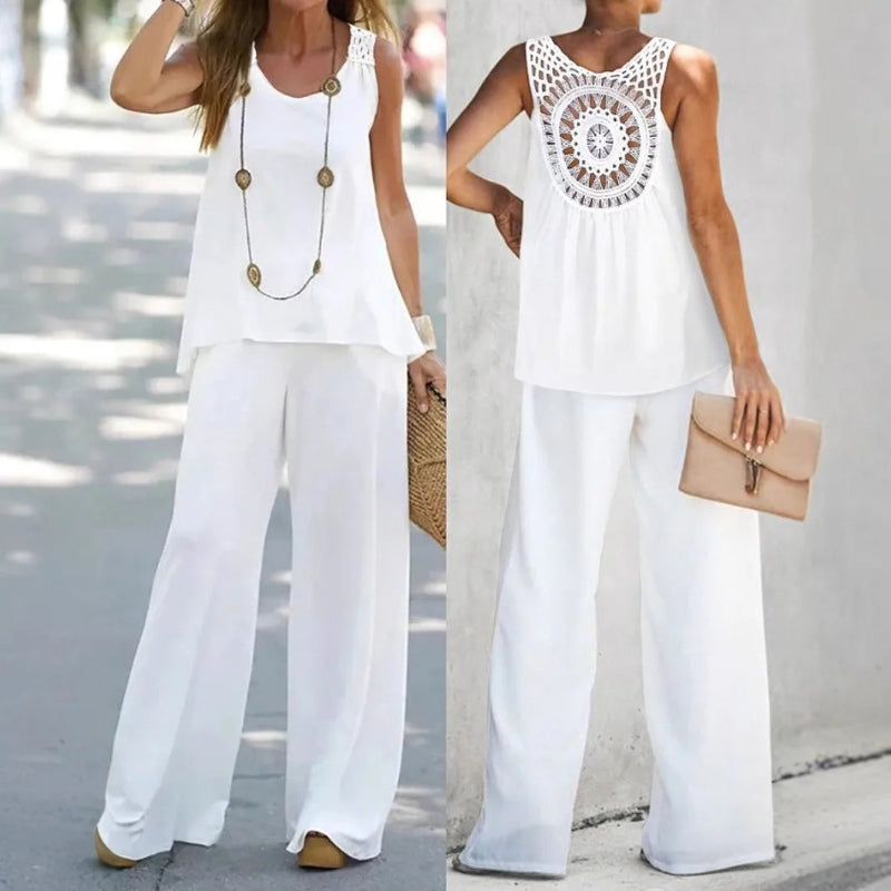 Two women wearing white outfits with a focus on a sleeveless top with a crochet pattern.