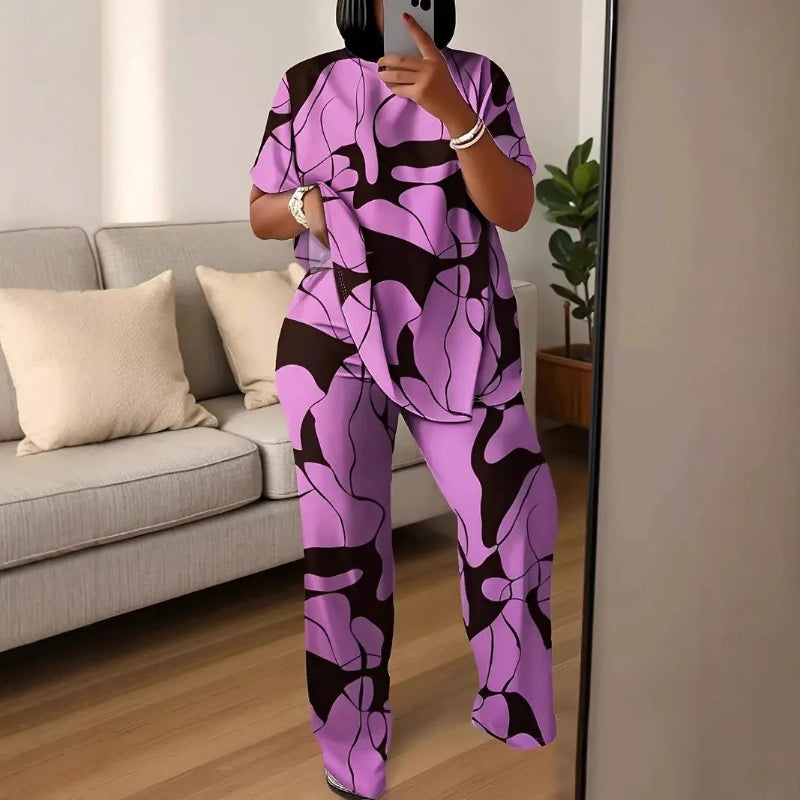 Person wearing a purple and black patterned outfit in a living room.
