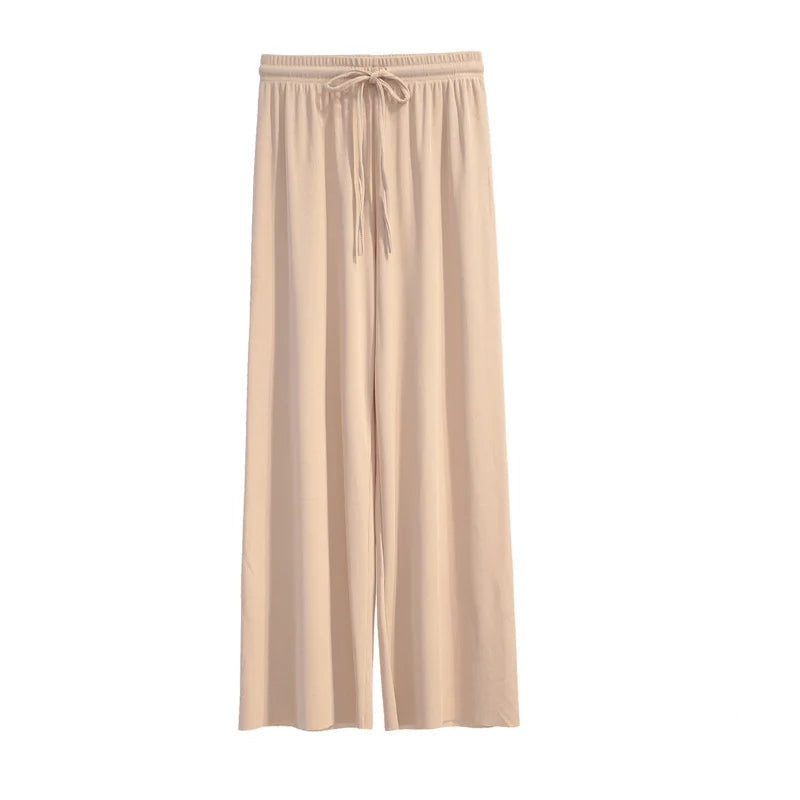 Beige lounge pants on a white background with text in the corner.