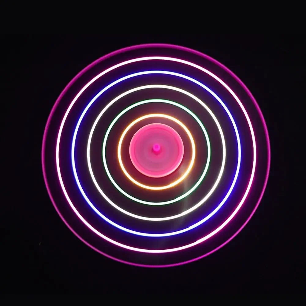 Neon circular light fixture on a black background