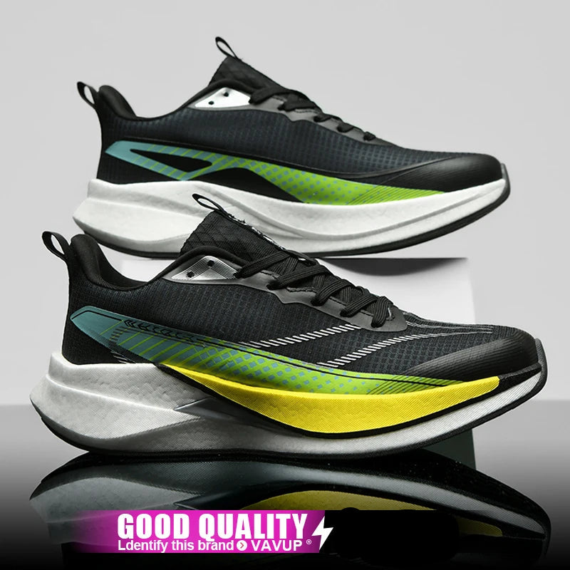 Black and green running shoes with a gray background