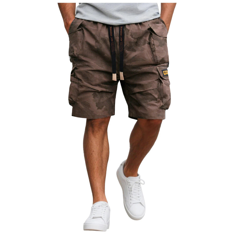 Brown cargo shorts worn by a person on a white background