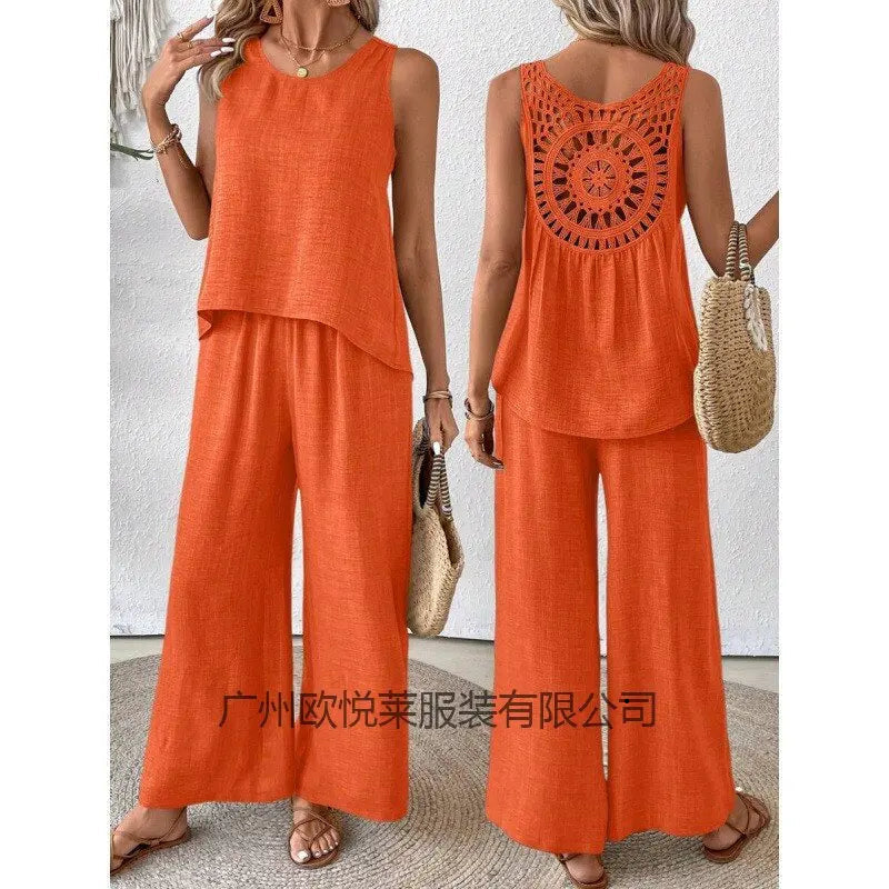 Woman wearing an orange outfit with a textured back design, holding a straw bag.