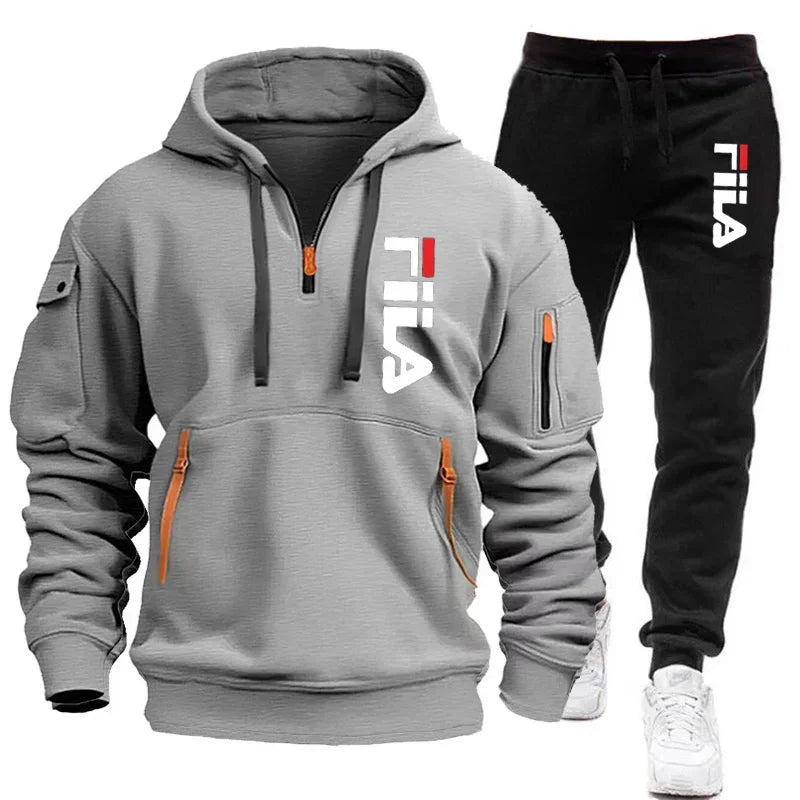 Gray hoodie and black pants with Fila logo on a white background