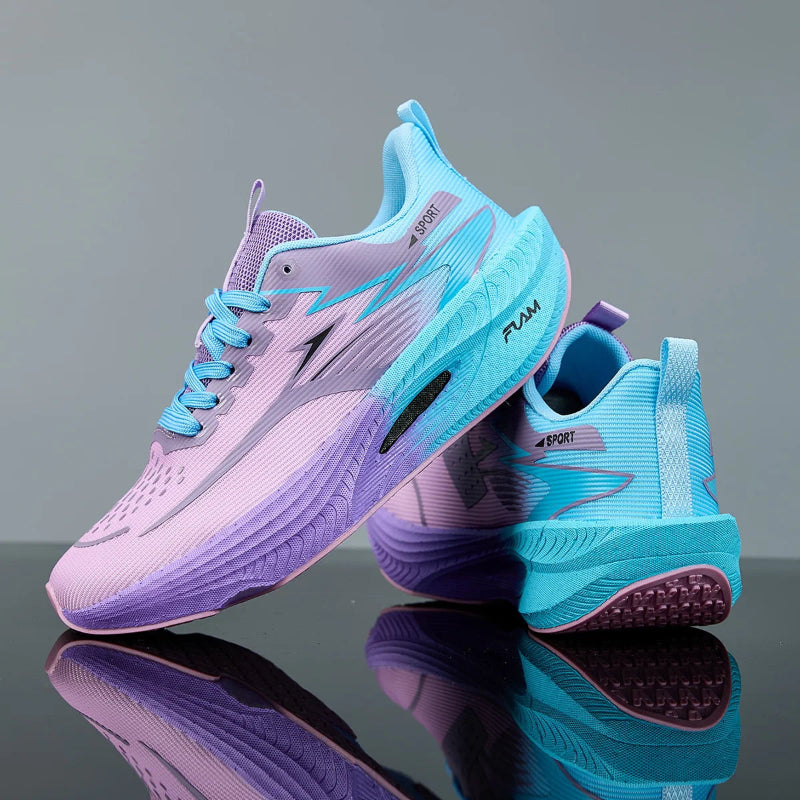 Pair of purple and blue running shoes on a reflective surface with a gray background