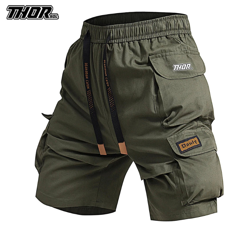 Green cargo shorts with multiple pockets and 'Thor' branding on a white background
