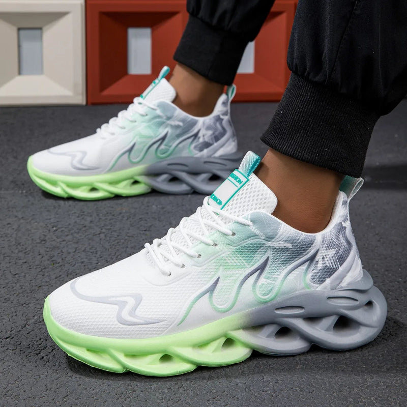 White and green sneakers worn by a person on a gray surface with a colorful background.