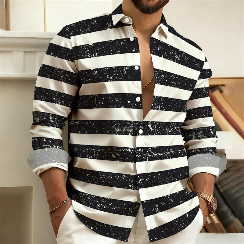Person wearing a black and white striped shirt with a patterned design.