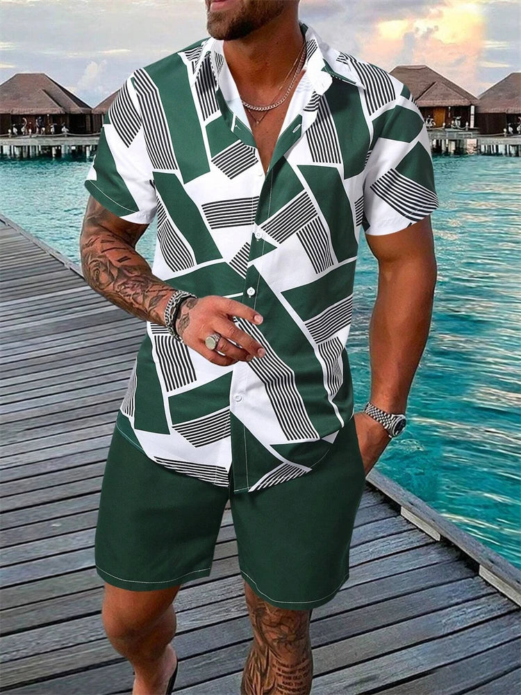 Man wearing a green and white patterned shirt and shorts by a waterfront.