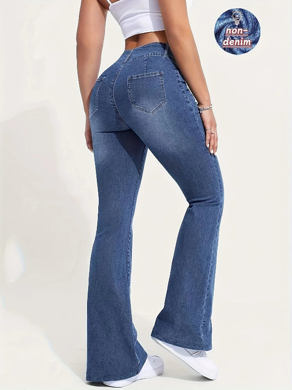 Person wearing blue flared jeans on a white background