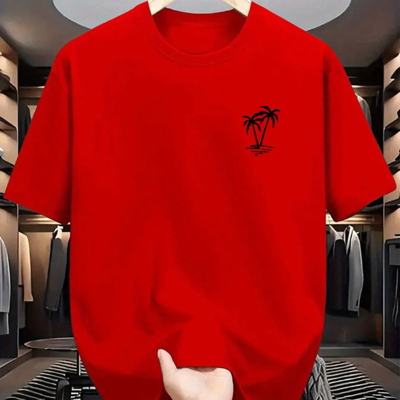 Red t-shirt with a black palm tree design held in a clothing store.