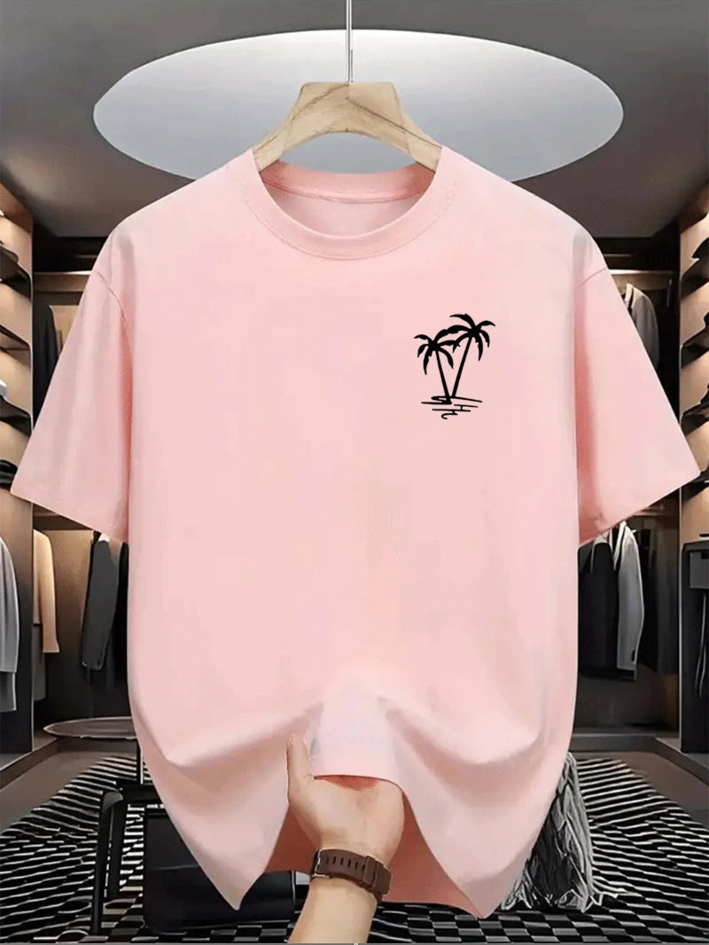 Pink t-shirt with a palm tree design on a hanger in a clothing store.