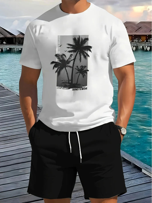 Person wearing a white t-shirt with a palm tree design by a waterfront.