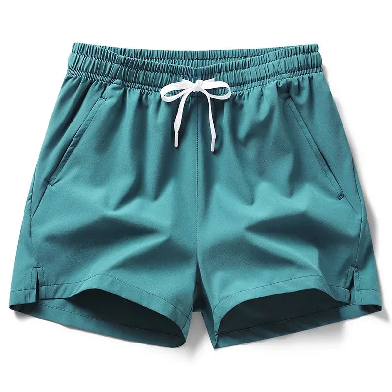 Teal shorts with a white drawstring on a white background