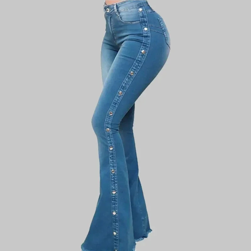 Blue flared jeans on a gray background