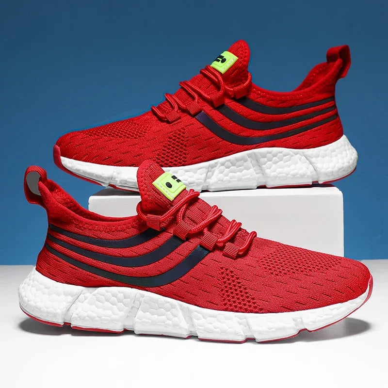 Red running shoes with white soles on a blue background