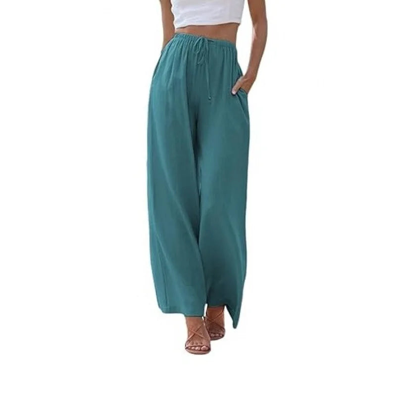 Teal wide-leg pants worn by a person on a white background