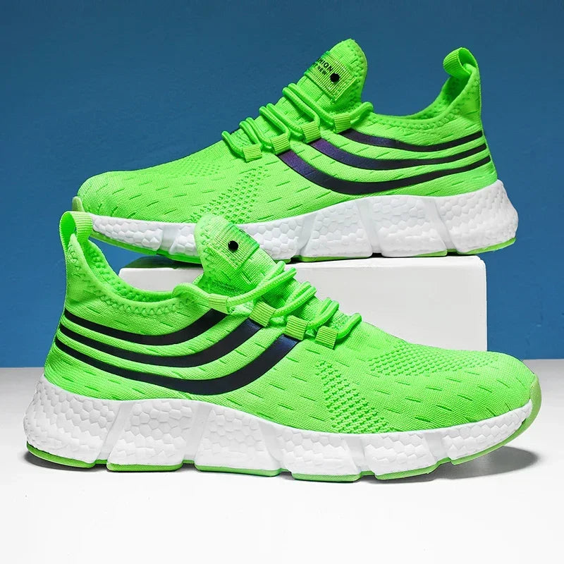 Bright green running shoes with black stripes on a blue background