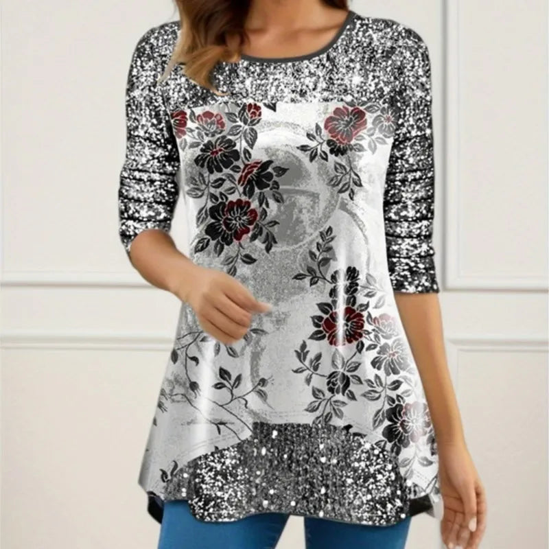 Floral patterned top with sequin details on a plain background