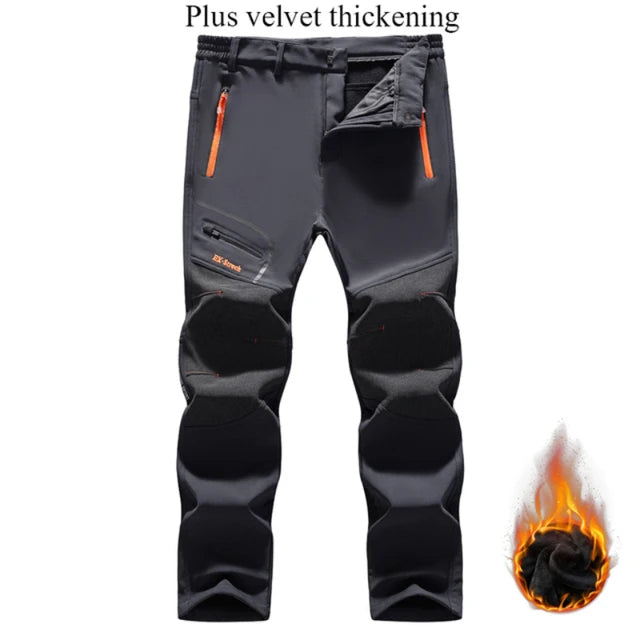 Gray pants with orange zippers and flame graphic on a white background