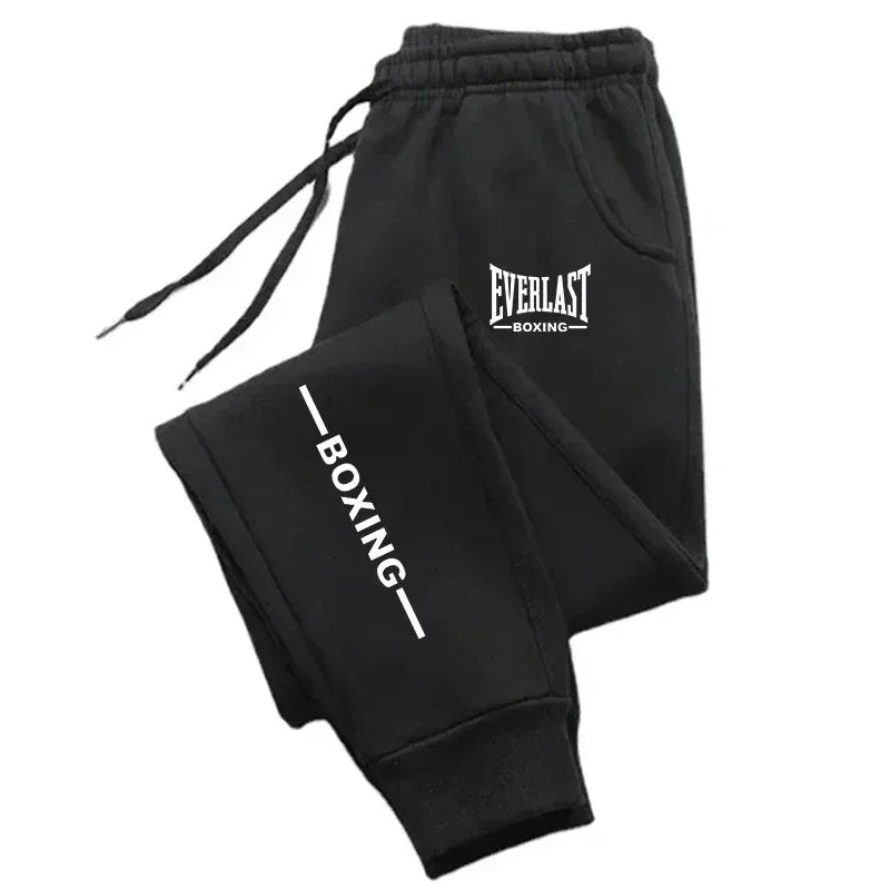 Black boxing sweatpants with 'Everlast Boxing' branding on a white background