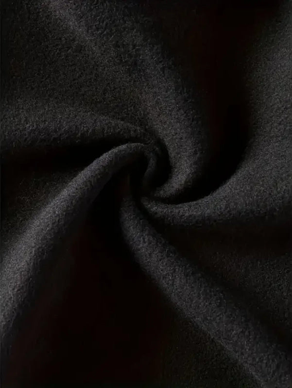 Close-up of dark gray fabric with folds