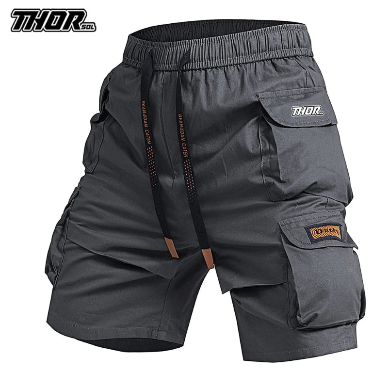 Gray cargo shorts with multiple pockets and 'Thor' branding on a white background