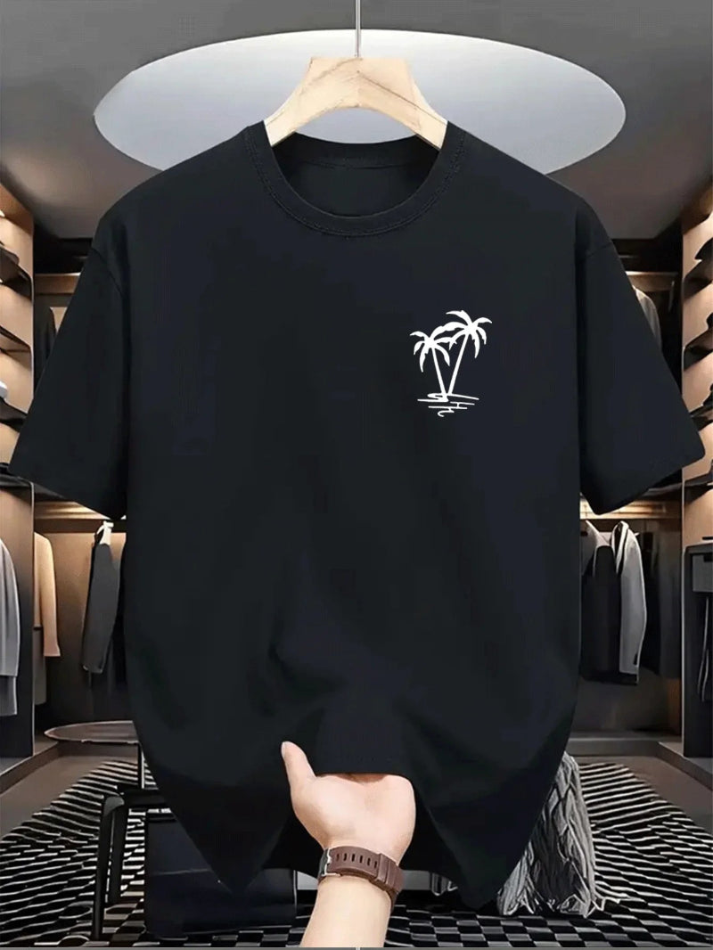 Black t-shirt with a white palm tree design on a hanger in a clothing store.